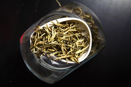 Chinese tea on wood plate background and rice paperの写真素材