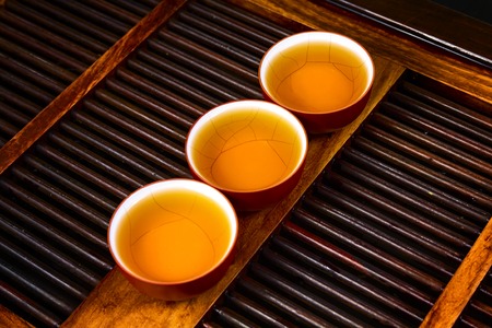 Chinese tea on wood plate background and rice paperの写真素材