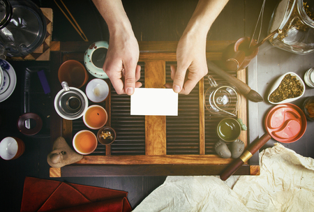 Chinese tea on wood plate background and rice paperの写真素材