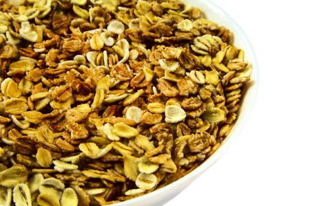 Oatmeal porridge close up on white isolated backgroundの写真素材