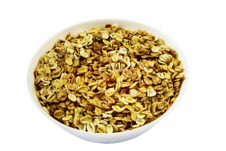 Oatmeal porridge close up on white isolated backgroundの写真素材