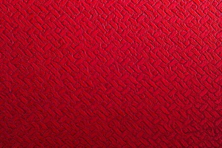 Nice warm red synthetic leather background textureの写真素材