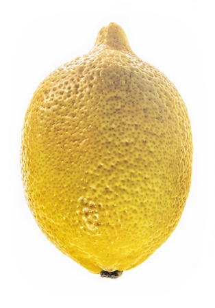 Nice yellow lemon standing vertical with light leaks on top on white isolated backgroundの写真素材