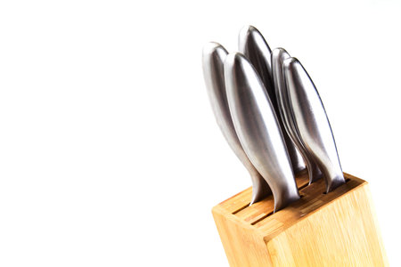 Kitchen knives in stand on white isolated background