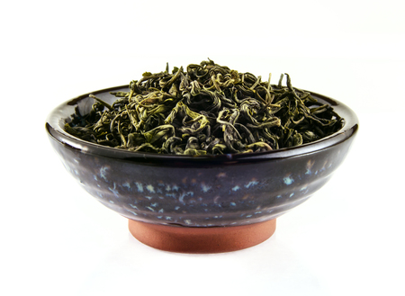 Chinese green tea in tea cup on white backgroundの写真素材