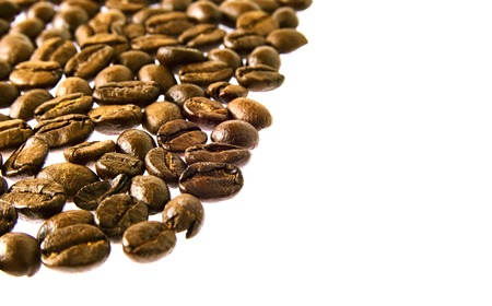 Many fresh brown coffee beans close upの写真素材