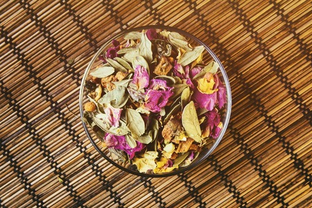 Tea in tea cup on wooden backgroundの写真素材