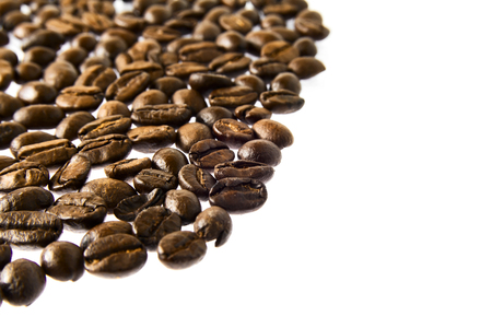 Many fresh brown coffee beans close upの写真素材