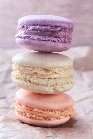 Nice macaroons on craft backgroundの写真素材