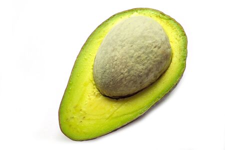 Avocado with big seed isolated on white backgroundの写真素材
