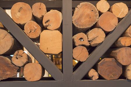 The texture of chopped firewood stacking. Harvesting firewood for the winter. Wooden logs, beams, firewoodの写真素材