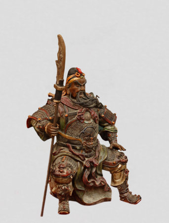 Old Chinese sculpture of ancient general isolated on whiteの写真素材