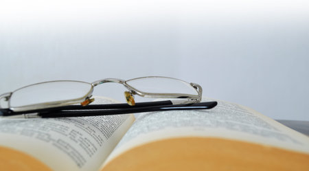Book and glasses background