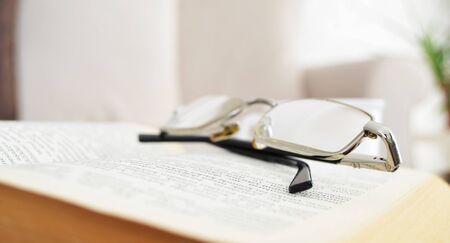 Book and glasses backgroundの写真素材