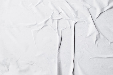 Creative background with scattered overlay of crumpled papers.