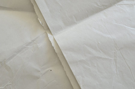 Creative background with scattered overlay of crumpled papers.