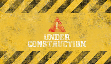 yellow warning sign. Under construction background.