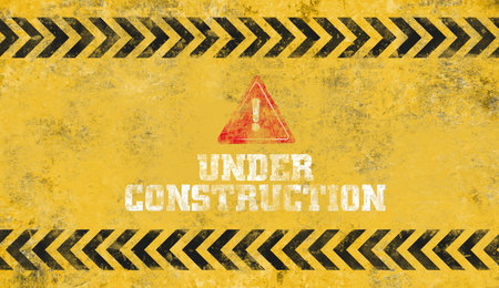 yellow warning sign. Under construction background.
