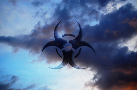 Biohazard sign on the cloudy sky background. 3D illustration.の写真素材