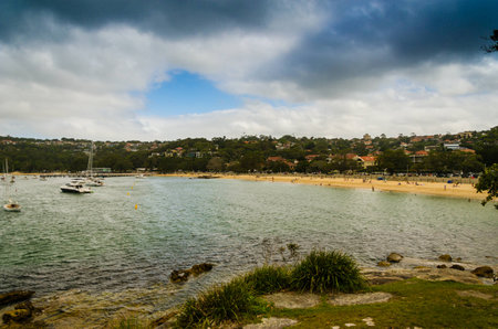Enjoying a day at a beach on a cloudy dayの写真素材