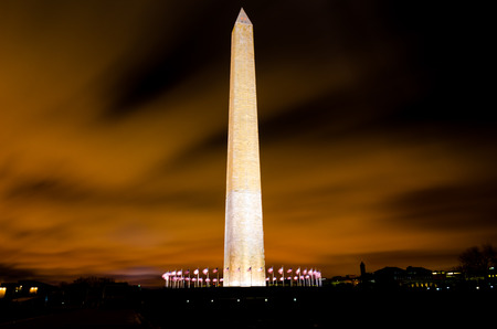 Washington monument during orange sunset with lightsのeditorial素材