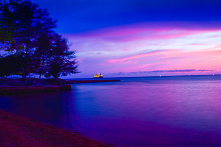 Gorgeous romantic purple blue sunset on a sandy beach in Indian Pacific sea ocean in South East Asia