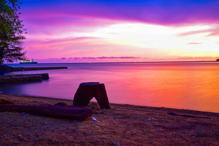 Gorgeous romantic purple blue sunset on a sandy beach in Indian Pacific sea ocean in South East Asiaの写真素材