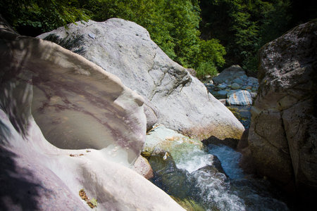 white rocks carved by the river Brembo val Brembana
