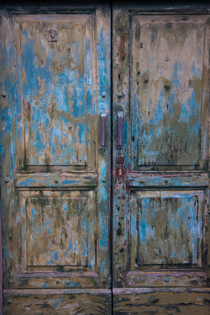 first floor of an old green wooden door