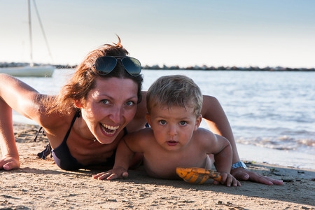 portrait of mother and son at the beachの写真素材