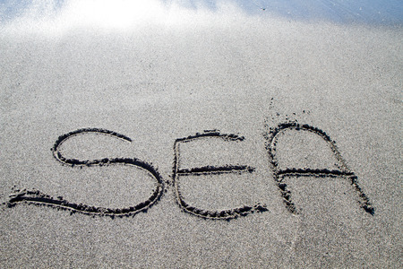 words written on the pebble beach, natural backgroundの写真素材