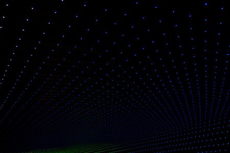 dark background with multicolored LEDs in perspectiveの写真素材