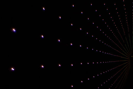 dark background with multicolored LEDs in perspective
