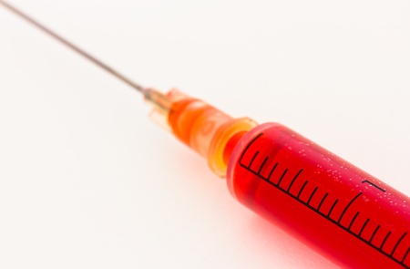 Syringe with red liquidの写真素材
