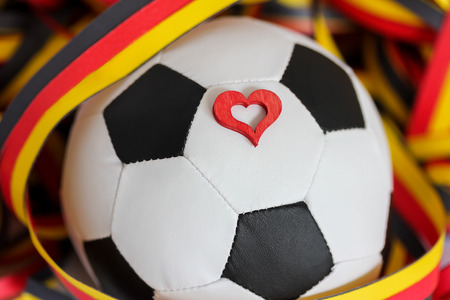 Football, streamers and a heartの写真素材