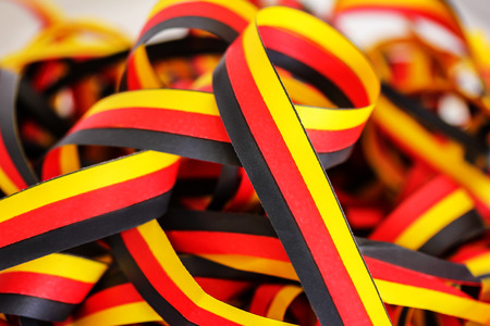 Streamers in black, red, yellowの写真素材