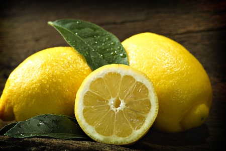Lemons with a sheet before dark backgroundの写真素材
