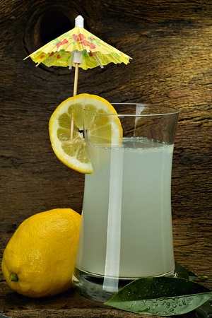 lemonade in a glass with lemon sliceの写真素材