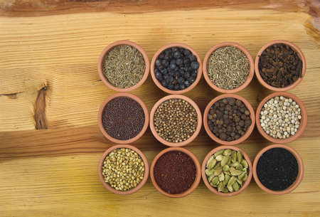 12 spices on a wooden boardの写真素材