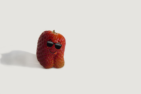 Funny strawberries in sunglasses going to the beachの写真素材