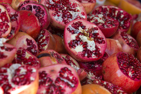 Sliced red grenade apple on local market in Istanbul