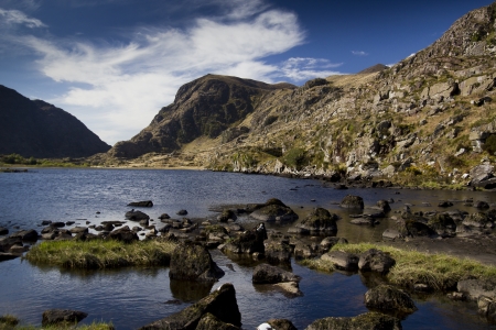 Beautiful mountain lake with rocks in front located  inside Gap of dunloe Killarney Ireland

の写真素材