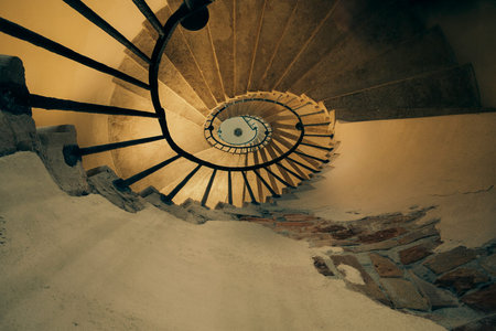 Architecture details of spiral staircases with nice dramatic light, located in Venice Italy