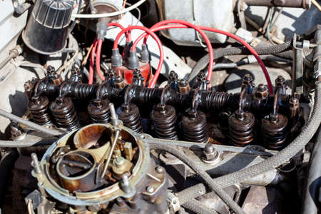 Disassembled carburetor motor. Cylinder head with rocker shaft installed on engine. DIY repair. valve settingの写真素材
