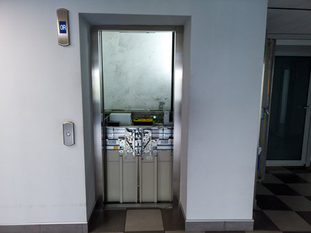 Elevator under maintenance. Broken elevator in open lift shaft. Out of service steel elevator.の写真素材