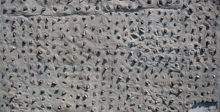 Concrete wall with decorative stones background. Concrete texture background. Granite stones pattern.の写真素材