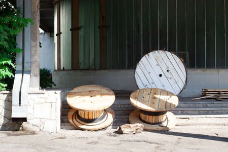 Large empty cable reels. nailed wood and plywood reels are used for a wide range of wire and cable applicationsの写真素材