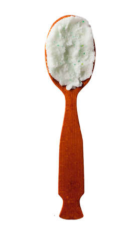 Body scrub with green crystals in wooden spoon. Homemade cosmetic for peeling and spa care. Isolated on white background.の写真素材