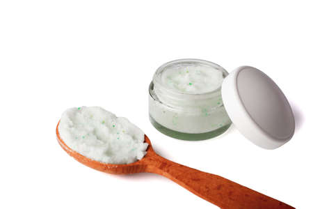 Body scrub with green crystals in wooden spoon. Homemade cosmetic for peeling and spa care. Isolated on white background.の写真素材