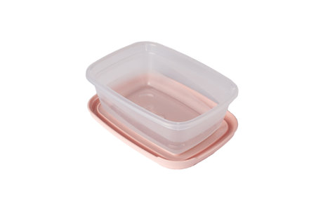 Open plastic food storage container with pink lid isolated on white background. Food box for lunch. Close upの写真素材